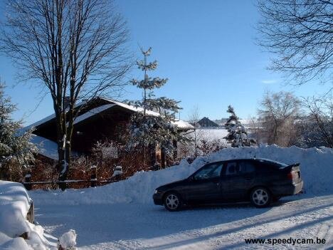 Nissan Primera covered in snow